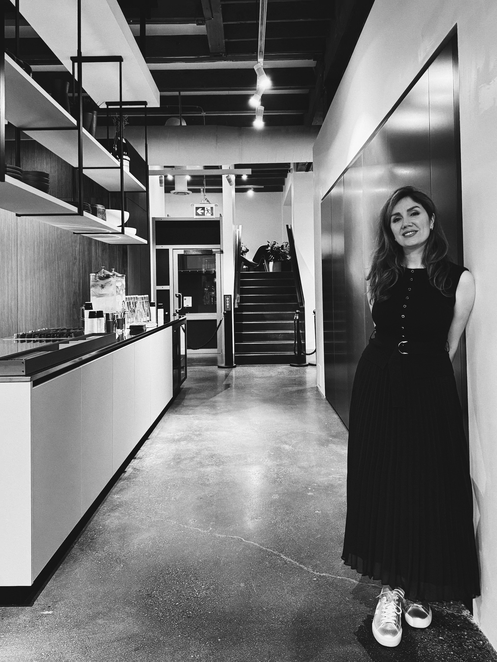 Maryam, designer at KI Atelier, standing inside the Vancouver showroom